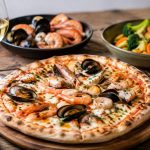 Pizza boisée lyonnaise : les meilleurs accords entre poissons, légumes et produits de la mer